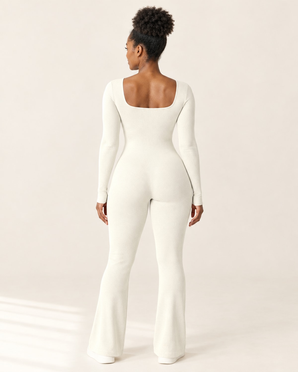 Studio Rib Flare Jumpsuit in Beige – back | Velvetella
