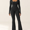 Studio Rib Flare Jumpsuit in Black – front | Velvetella